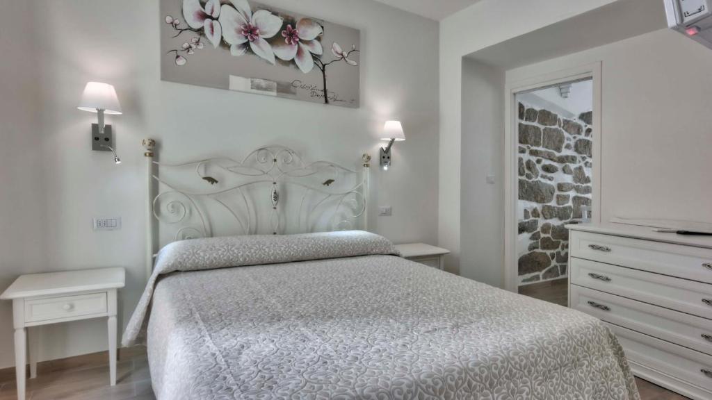 Postel nebo postele na pokoji v ubytování Smart Suite & Apartments