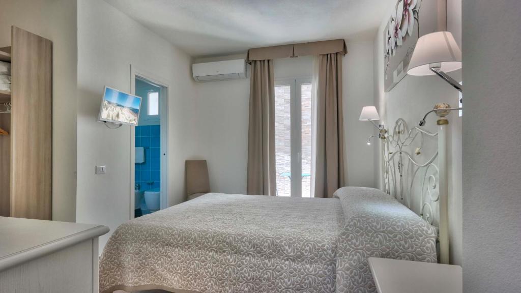 Postel nebo postele na pokoji v ubytování Smart Suite & Apartments