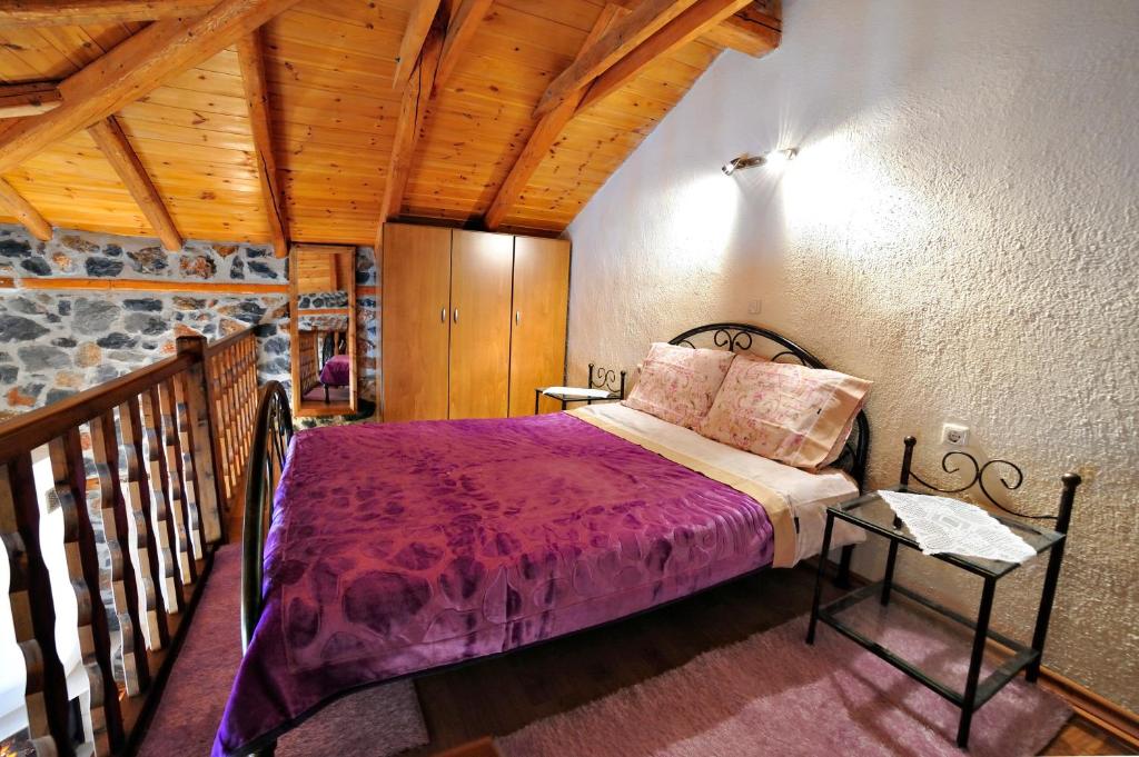 מיטה או מיטות בחדר ב-Aroma Elatis