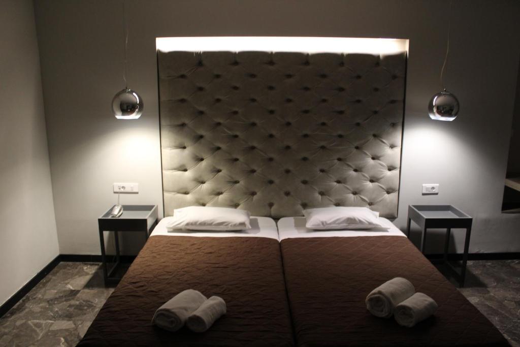Postel nebo postele na pokoji v ubytování Galaxy Hotel