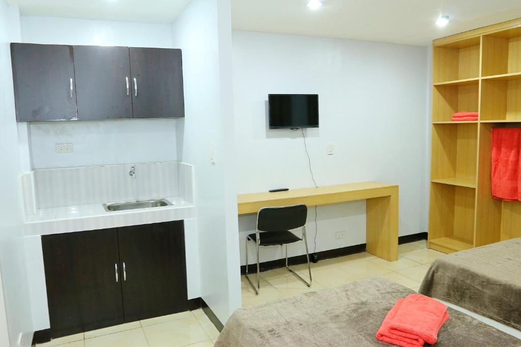 TV a/nebo společenská místnost v ubytování Global 88 Apartelle