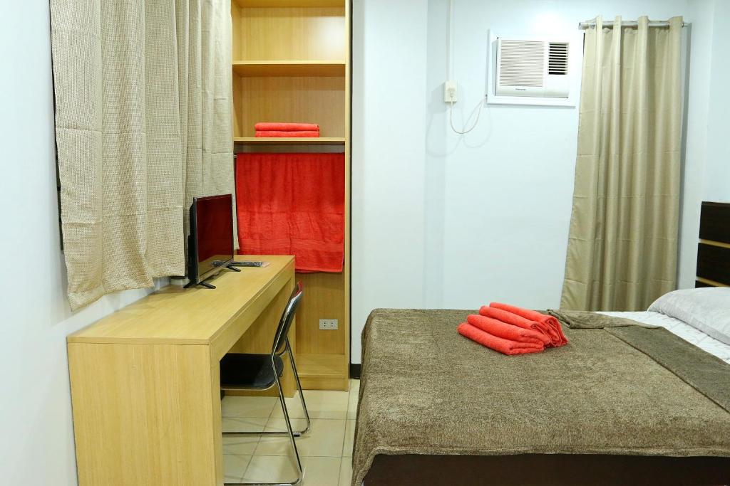 Postel nebo postele na pokoji v ubytování Global 88 Apartelle