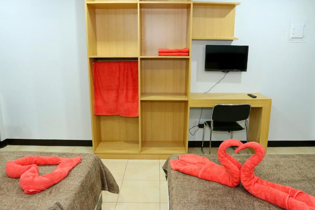 TV a/nebo společenská místnost v ubytování Global 88 Apartelle