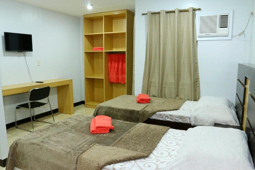 TV a/nebo společenská místnost v ubytování Global 88 Apartelle