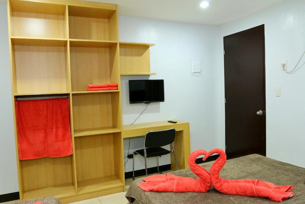 TV a/nebo společenská místnost v ubytování Global 88 Apartelle