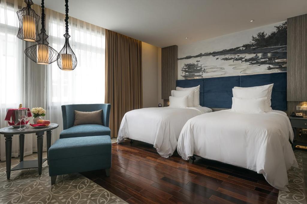 Postel nebo postele na pokoji v ubytování Paradise Suites Hotel