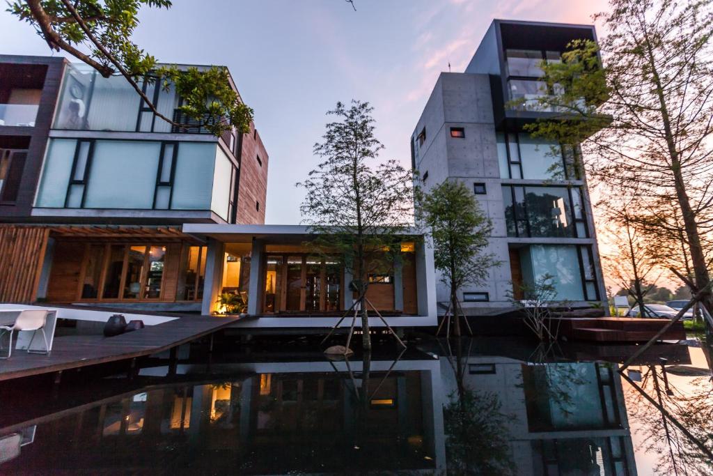 a house with a pool in front of it at 呆宅Just Stay in Dongshan