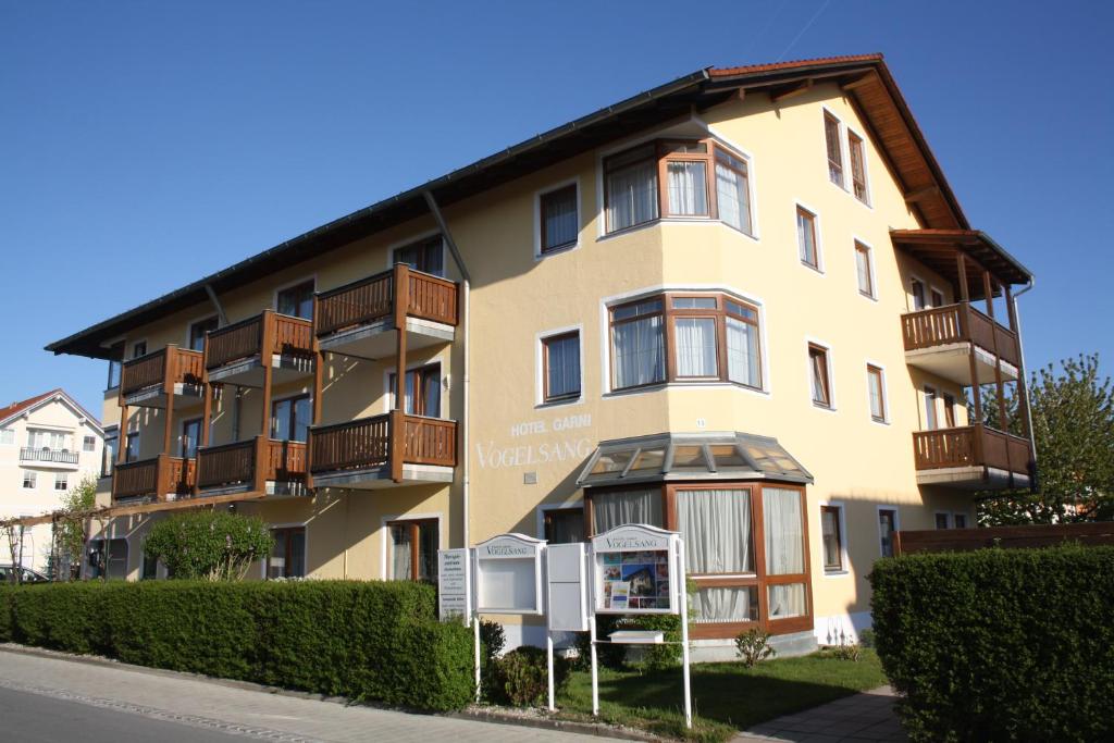 a building with balconies on the side of it at Hotel garni Vogelsang in Bad Füssing