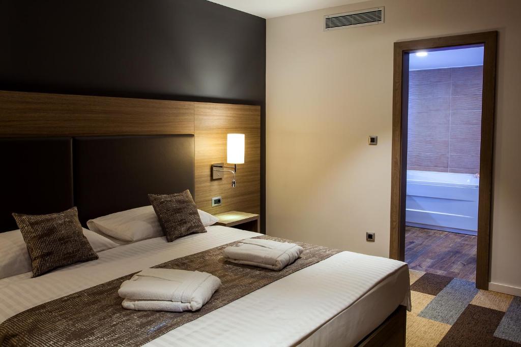 Postel nebo postele na pokoji v ubytování Hotel Princess