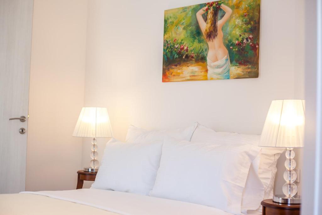 Postel nebo postele na pokoji v ubytování Danezis City Stars Boutique Aparthotel
