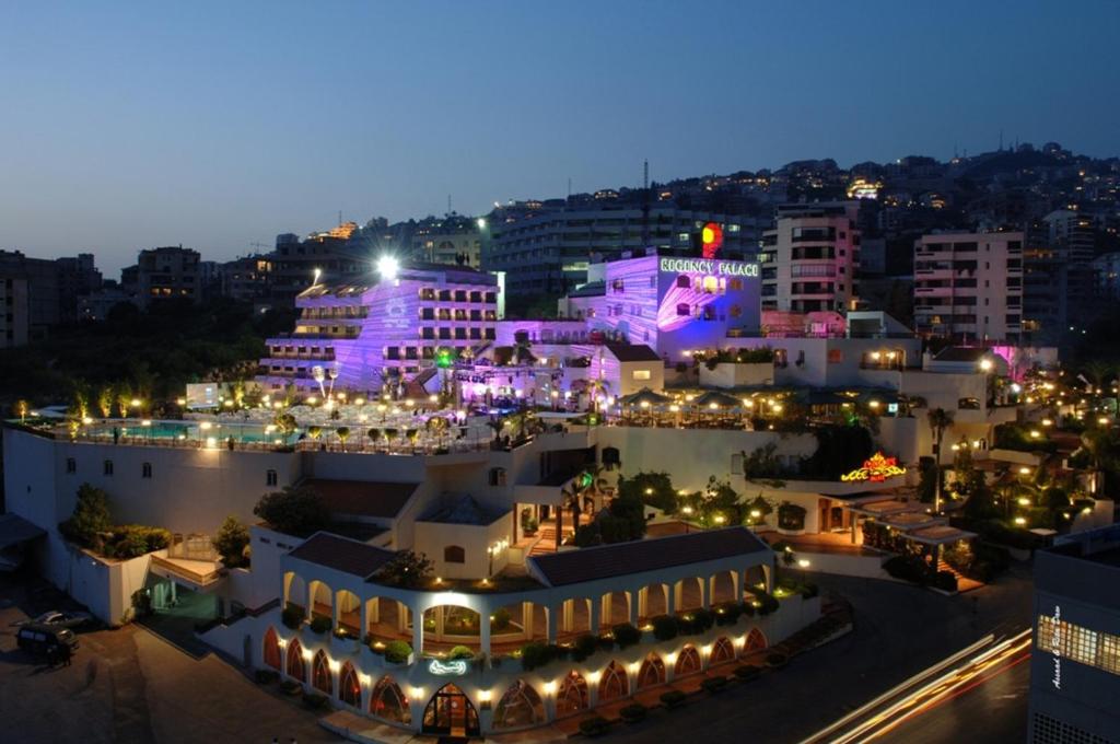 a view of a city at night with lights at Regency Palace Hotel in Jounieh