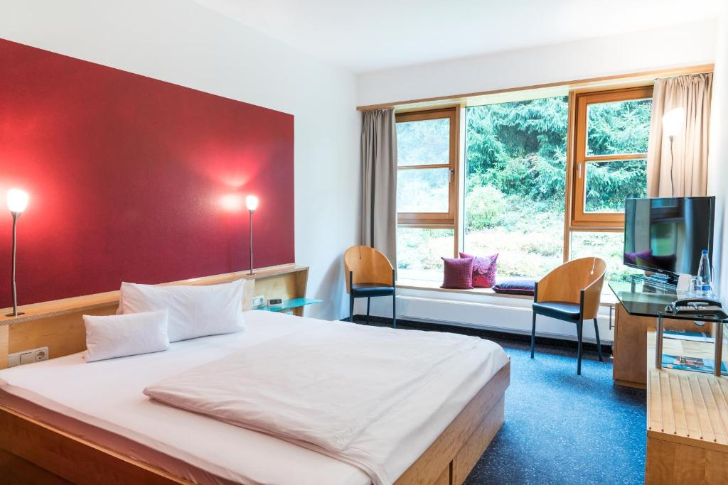 Postel nebo postele na pokoji v ubytování Hotel Kongressissimo