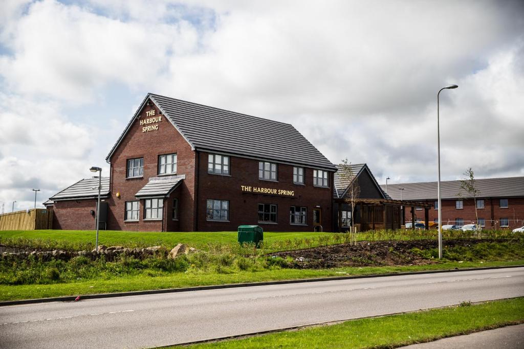 a large brick building on the side of a road at Harbour Spring, Peterhead by Marston's Inns in Peterhead