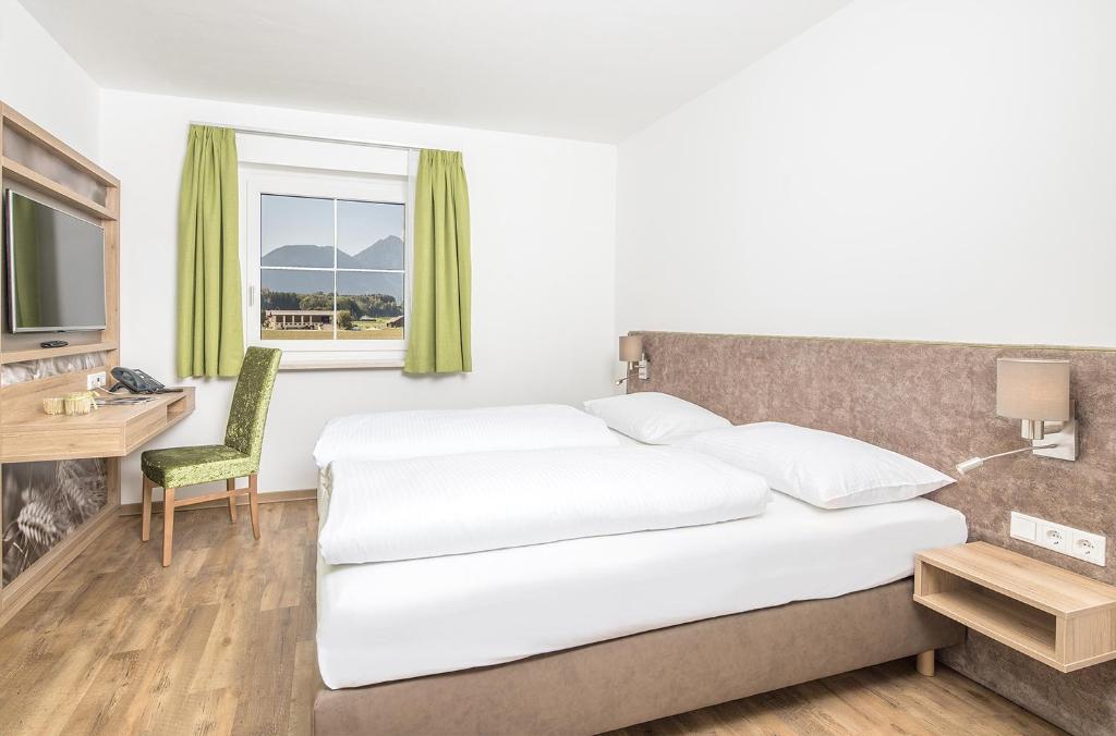 Posteľ alebo postele v izbe v ubytovaní Hotel & Restaurant Rupertigau