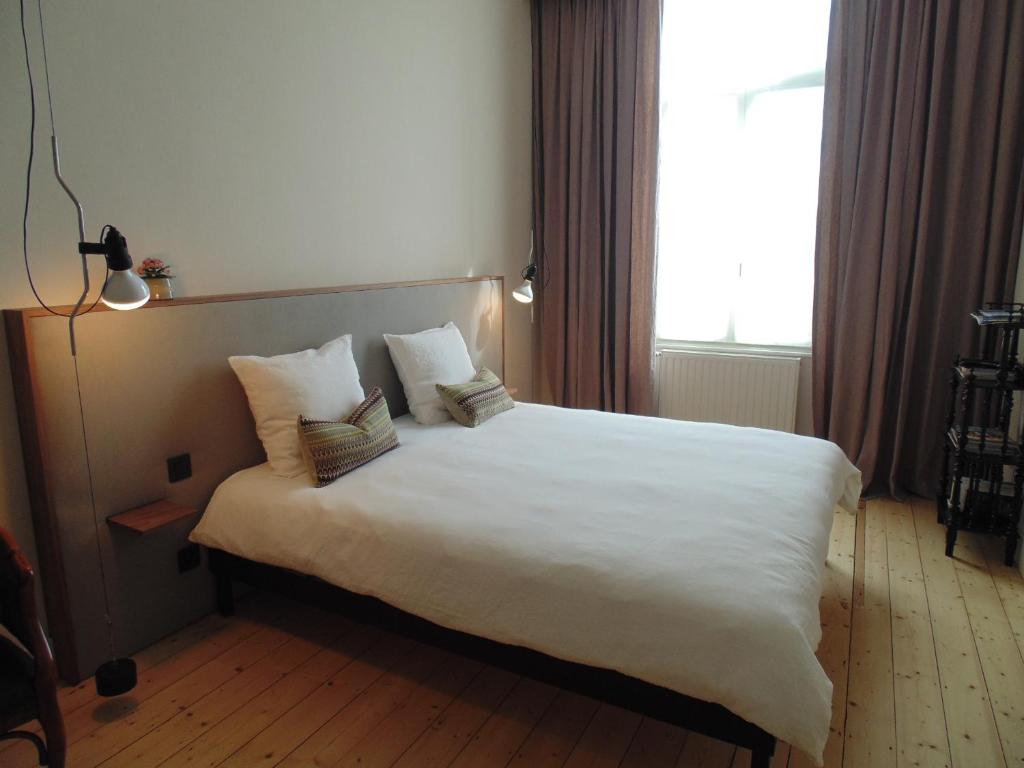 Postel nebo postele na pokoji v ubytování B&B De Gilleminus