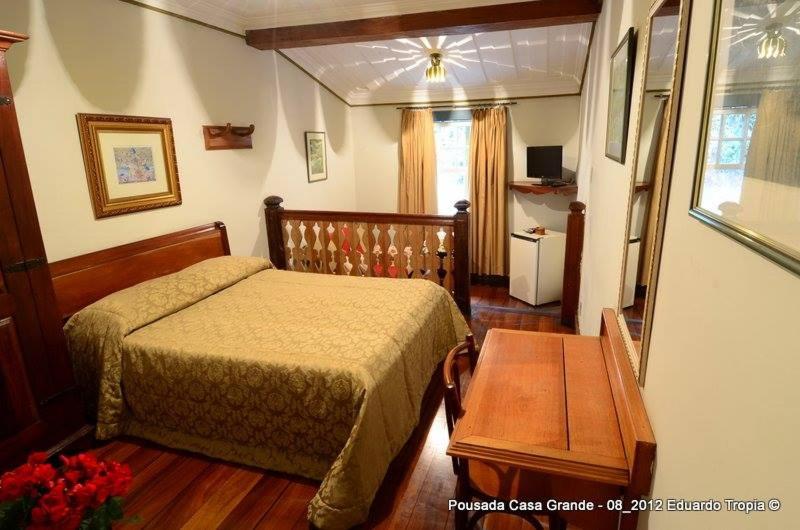 Postel nebo postele na pokoji v ubytování Hotel Pousada Casa Grande