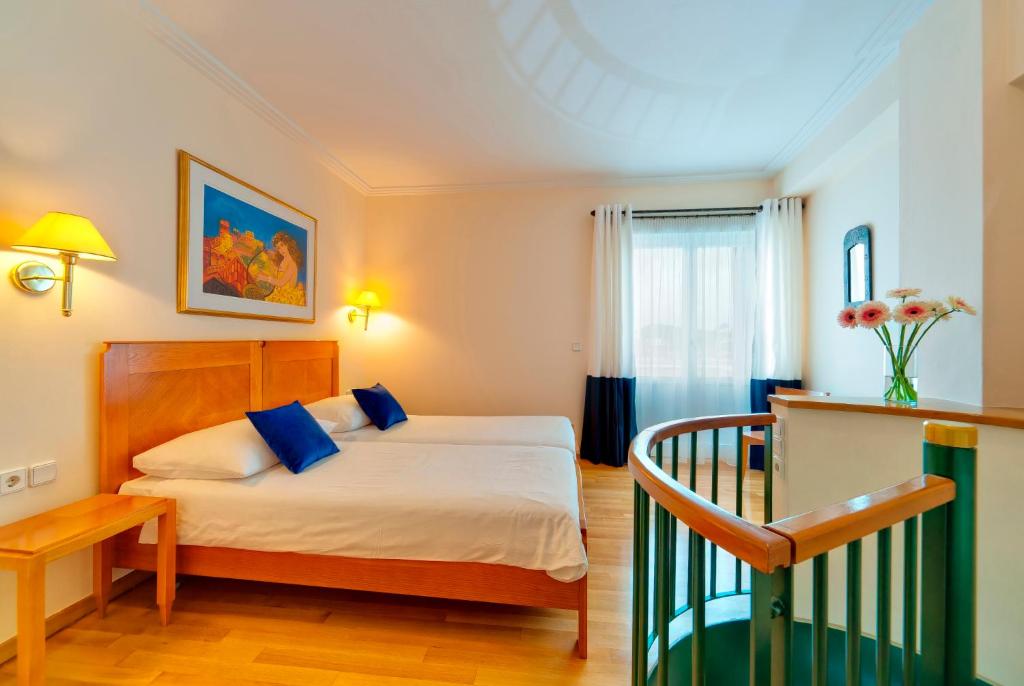 Posteľ alebo postele v izbe v ubytovaní Hapimag Apartments Athens