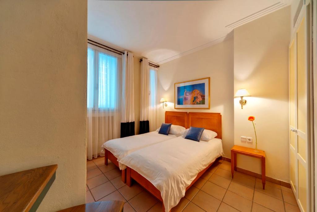 Posteľ alebo postele v izbe v ubytovaní Hapimag Apartments Athens