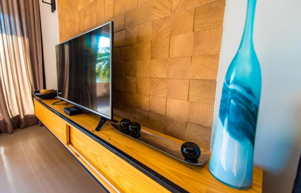 TV a/nebo společenská místnost v ubytování Ballena Regency