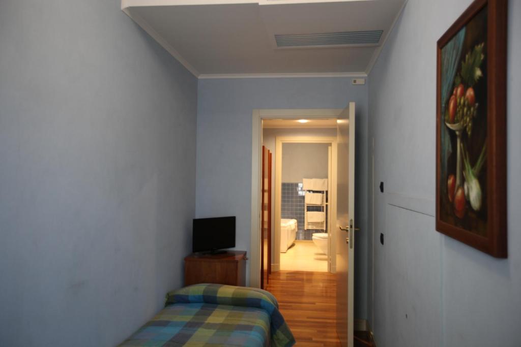 Postel nebo postele na pokoji v ubytování Hotel Rosa