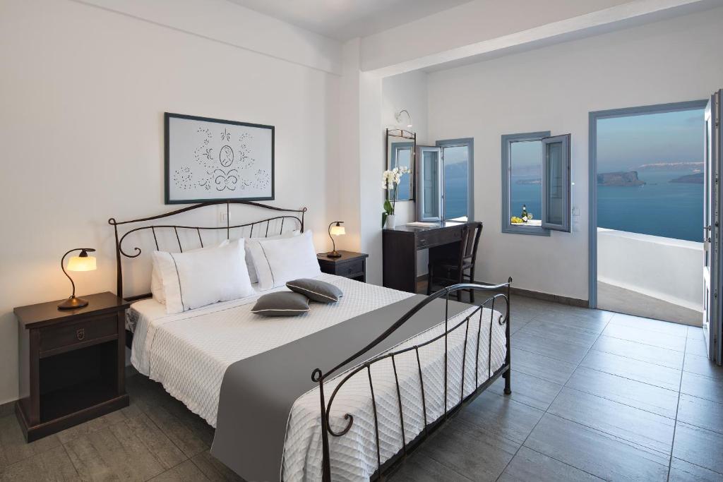Postel nebo postele na pokoji v ubytování Apanemo Hotel & Suites