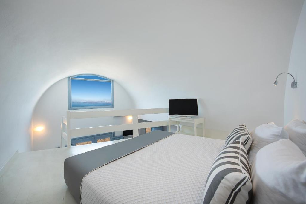 Postel nebo postele na pokoji v ubytování Apanemo Hotel & Suites