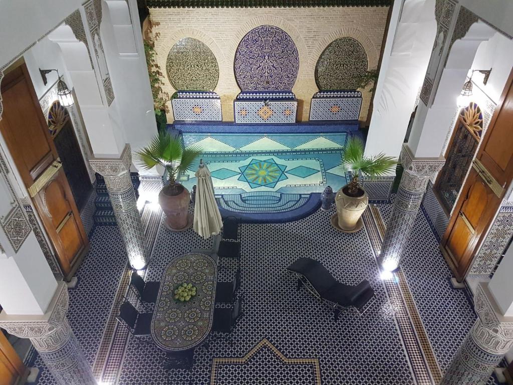 an overhead view of a pool in a building at Riad Soleil d'Or in Fez