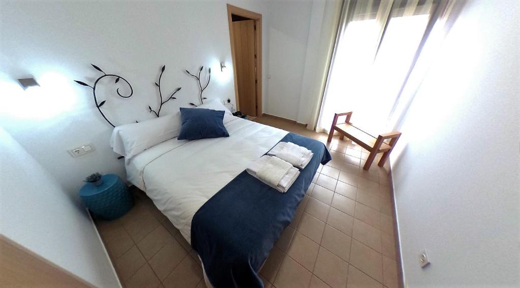 Postel nebo postele na pokoji v ubytování Hostal Aquaforum