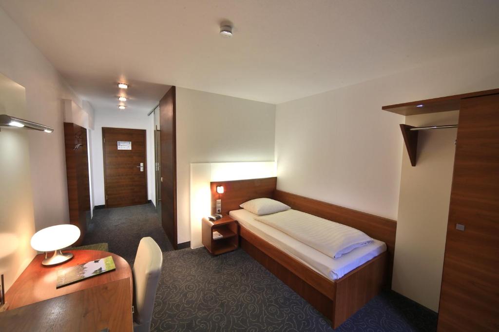 Postel nebo postele na pokoji v ubytování Landidyll Hotel Klostermühle