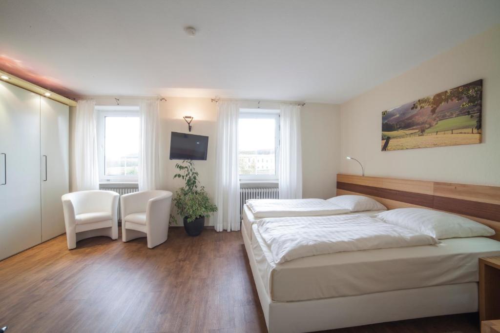 Postel nebo postele na pokoji v ubytování Landidyll Hotel Klostermühle