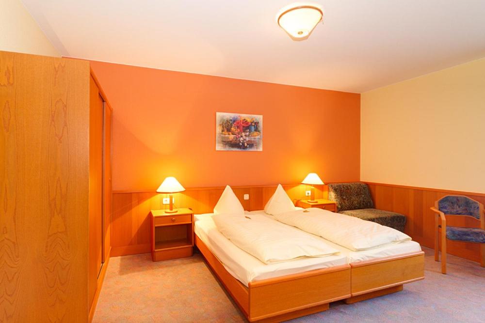 Postel nebo postele na pokoji v ubytování Hotel Tilman