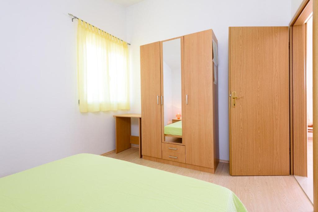 Posteľ alebo postele v izbe v ubytovaní Apartmani Beran