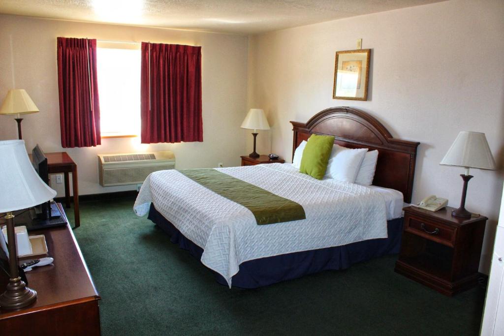 En eller flere senger på et rom på Scipio Hotel