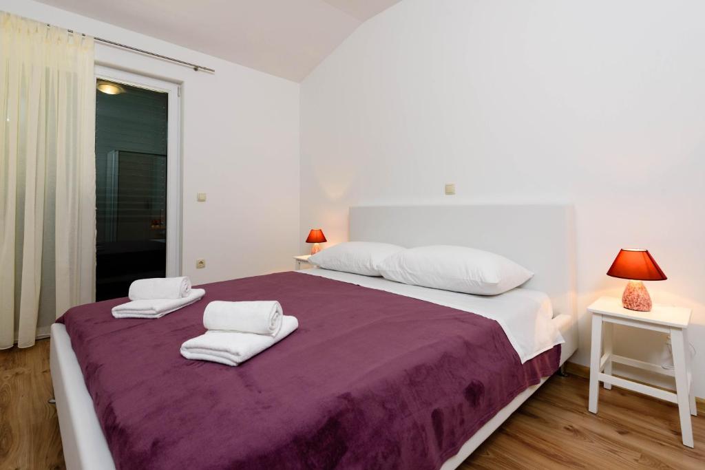 Posteľ alebo postele v izbe v ubytovaní Apartmani Beran