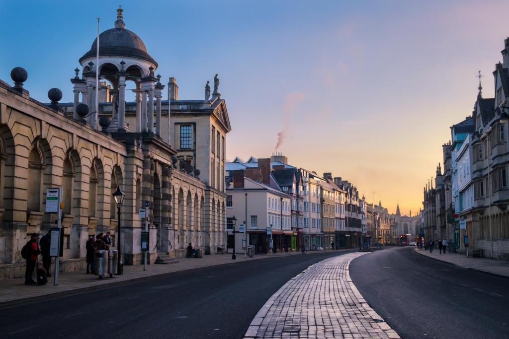 an empty street in a city with buildings at Golden Cross Guesthouse in Oxford