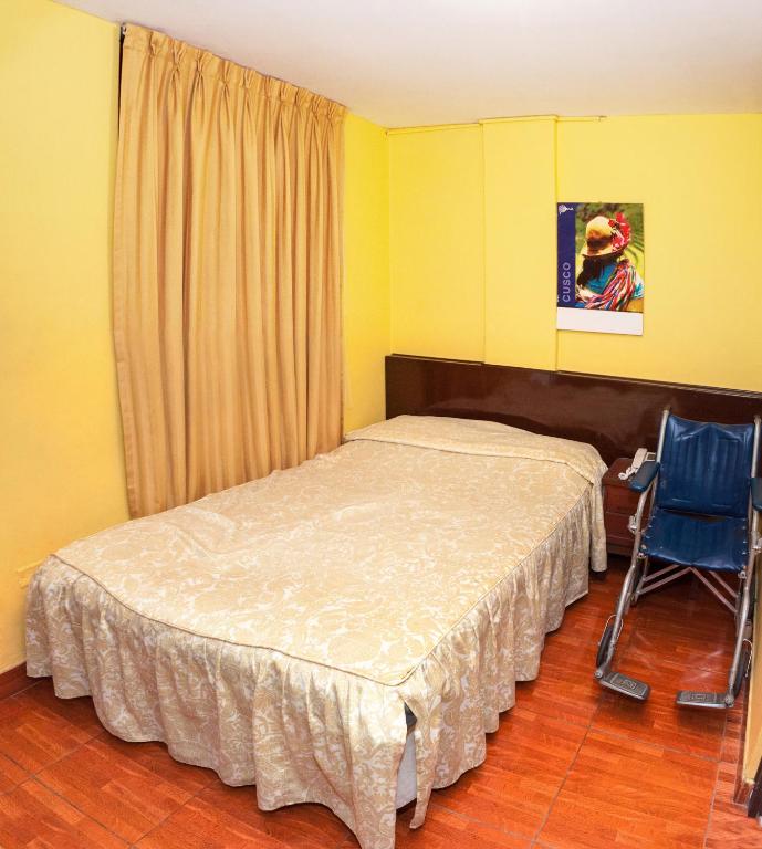 Postel nebo postele na pokoji v ubytování Hostal Iquique