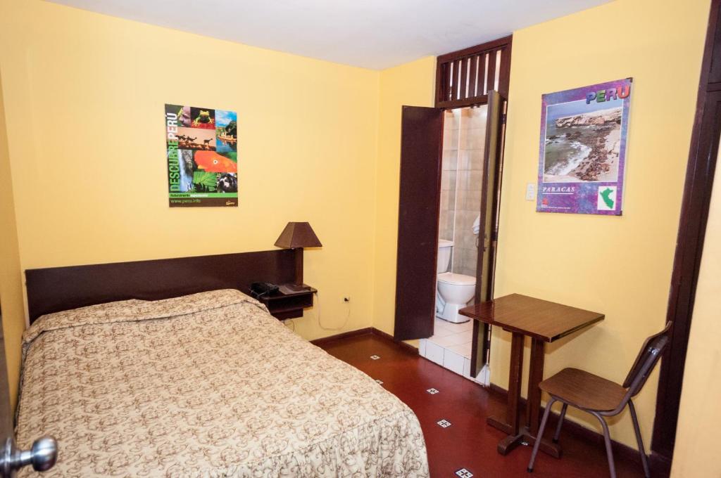 Postel nebo postele na pokoji v ubytování Hostal Iquique
