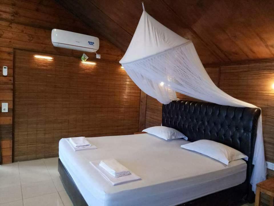 Postel nebo postele na pokoji v ubytování Pele's Place