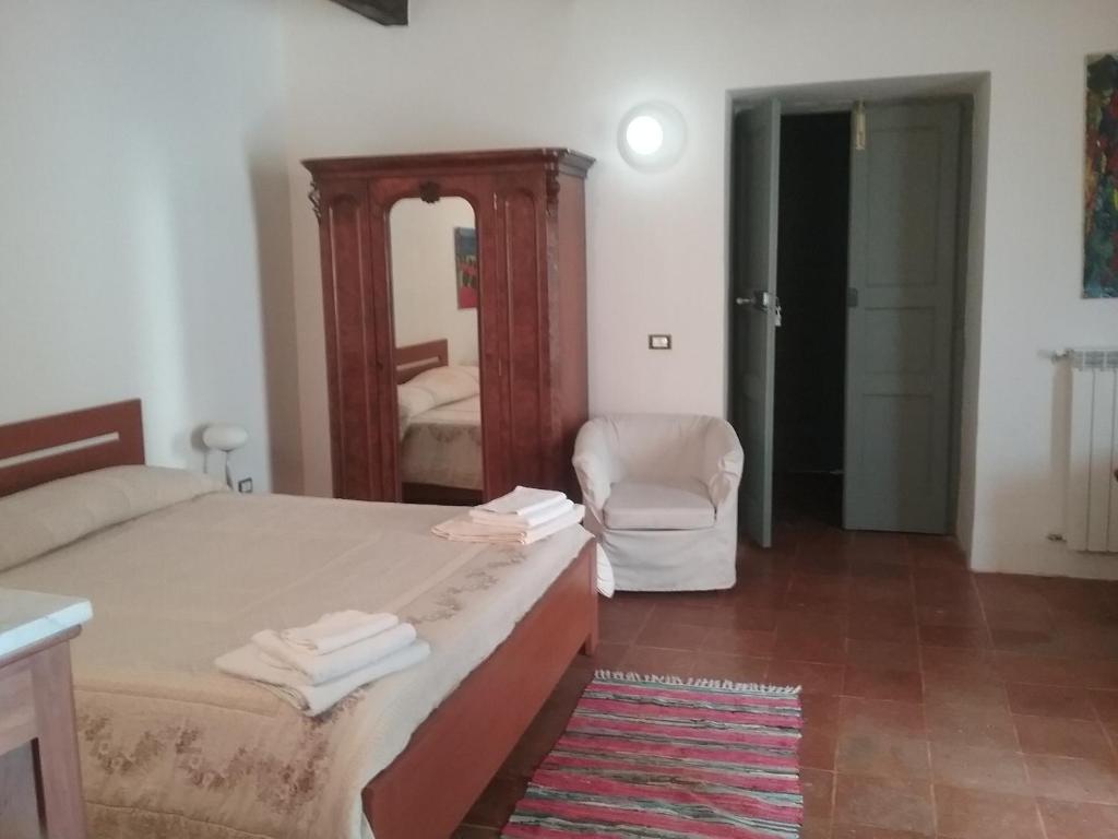 Łóżko lub łóżka w pokoju w obiekcie b&b Vallone del grano