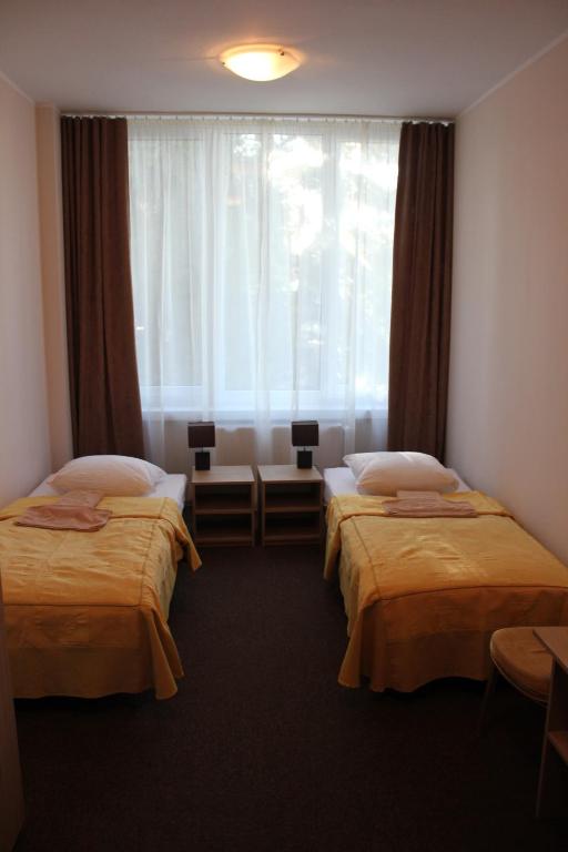Postel nebo postele na pokoji v ubytování OSW Mega