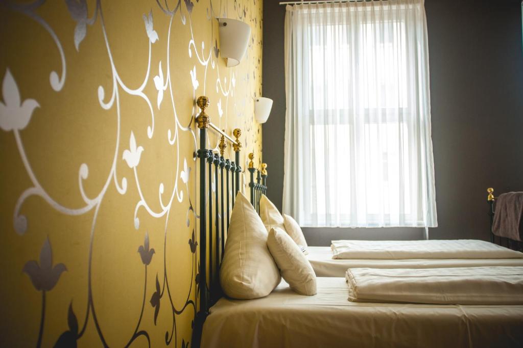 Postel nebo postele na pokoji v ubytování Hotel Alexander