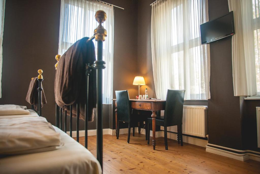 TV a/nebo společenská místnost v ubytování Hotel Alexander