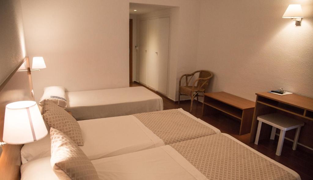 Cama o camas de una habitación en Carlos III