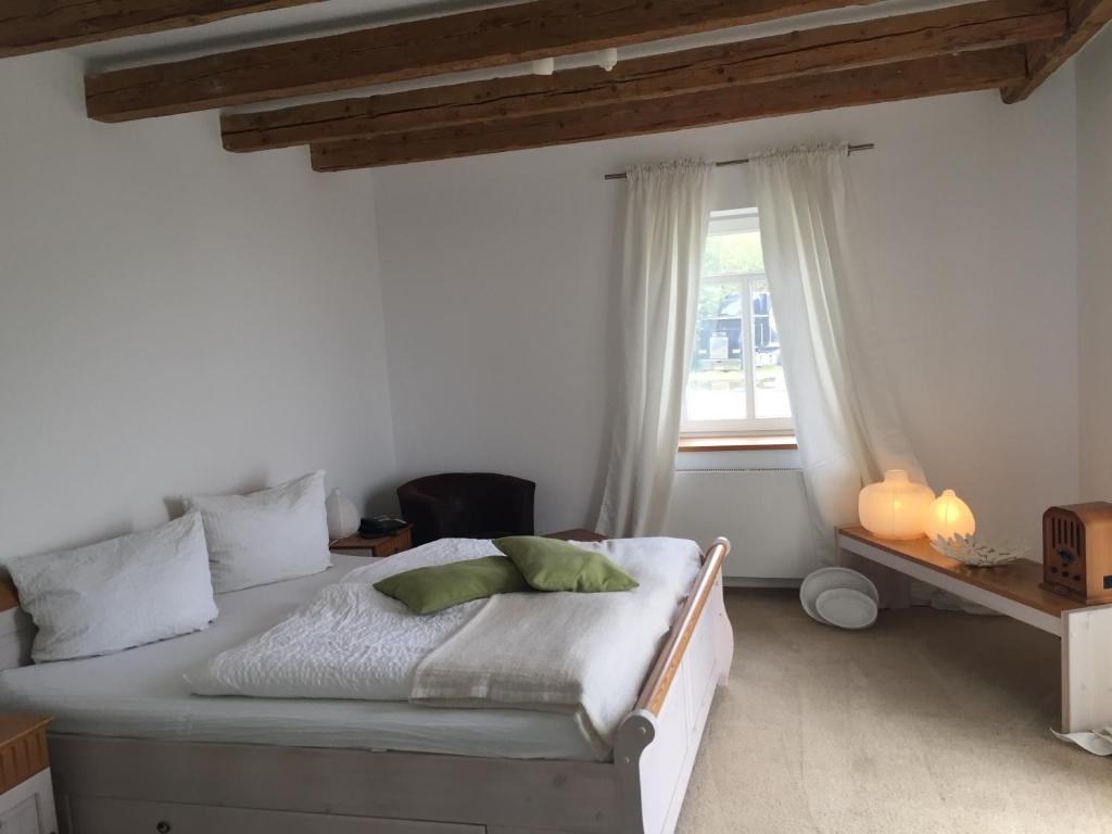 a bedroom with a bed and a window at Schwedenfrieden in Bielefeld