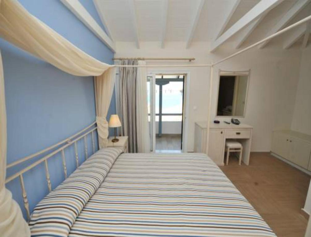 Postel nebo postele na pokoji v ubytování Hotel Agios Nikitas