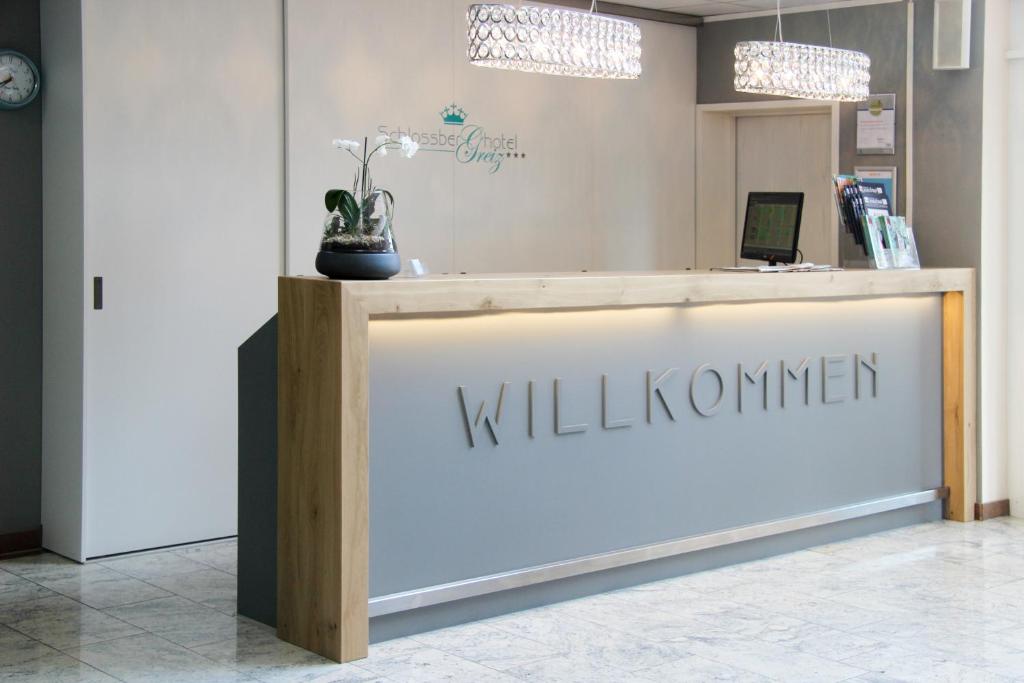 a lobby of a wellness center with a reception desk at Schlossberghotel Greiz in Greiz