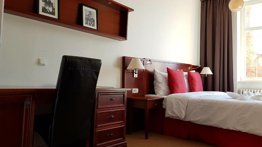 Łóżko lub łóżka w pokoju w obiekcie B&B Hotel Praha