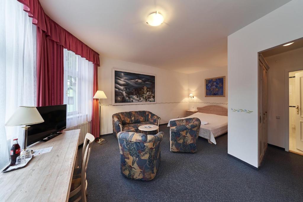 TV a/nebo společenská místnost v ubytování Hotel Hořec