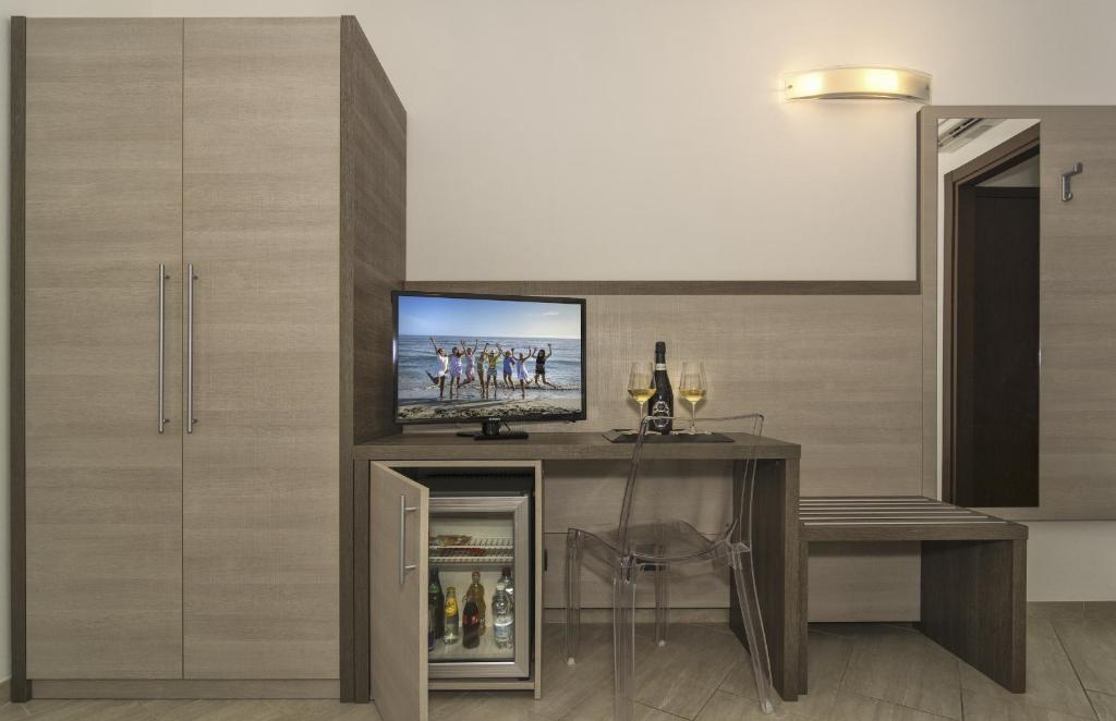 TV a/nebo společenská místnost v ubytování Hotel Lido Inn