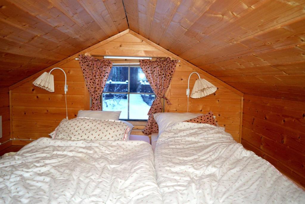 Haukeli Mountain Cabin tesisinde bir odada yatak veya yataklar